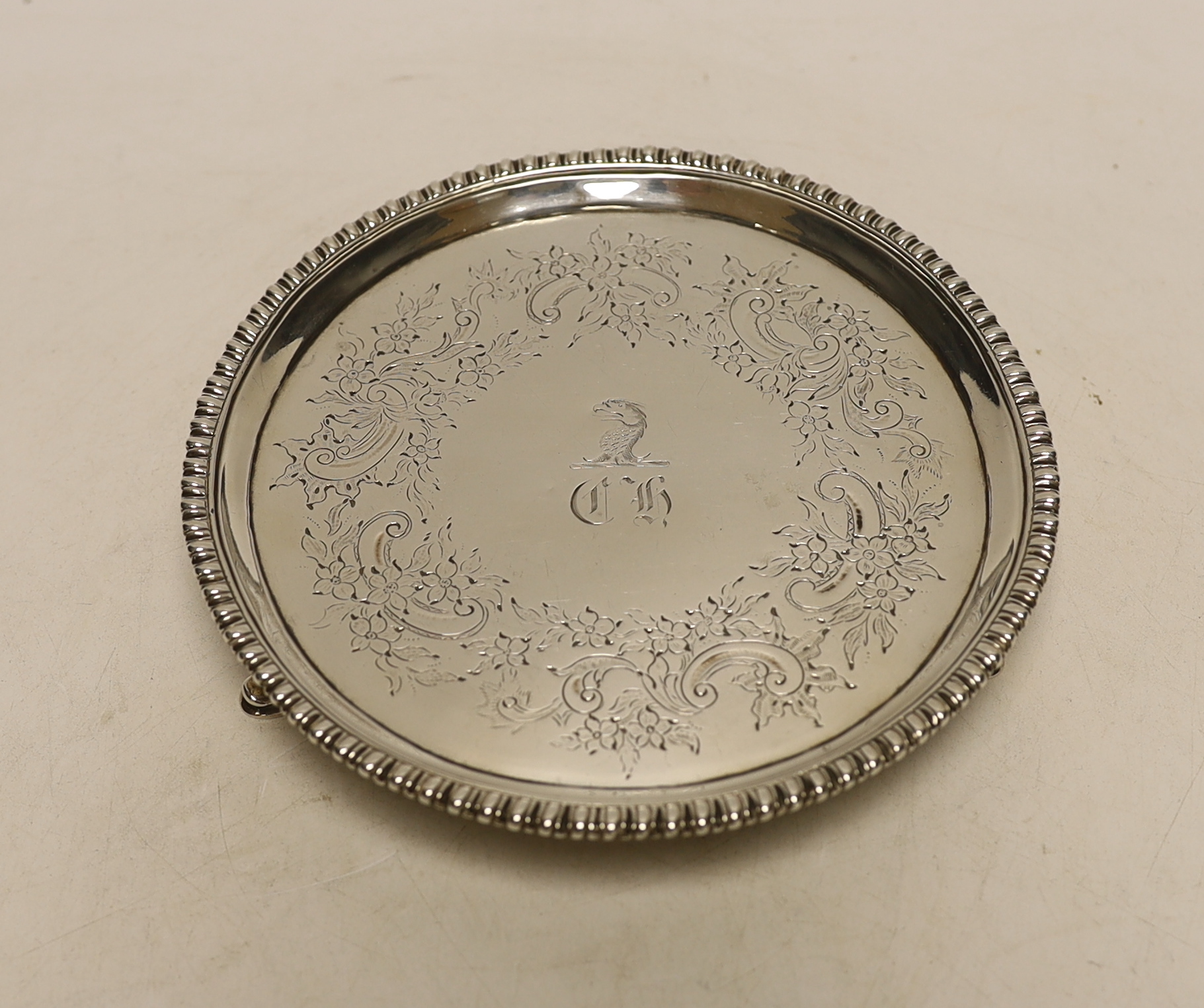 A George III silver waiter by Ebenezer Coker, London, 1771, with later engraved decoration, 15.2cm, 6.4oz.
